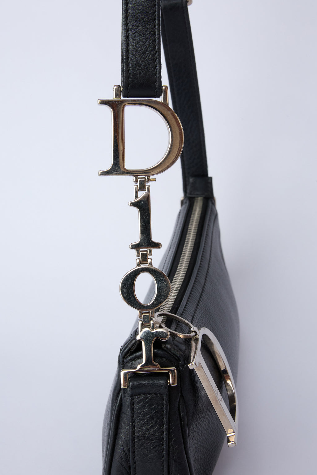 DIOR DIORISSIMO BLACK SPELLOUT CHARM POCHETTE