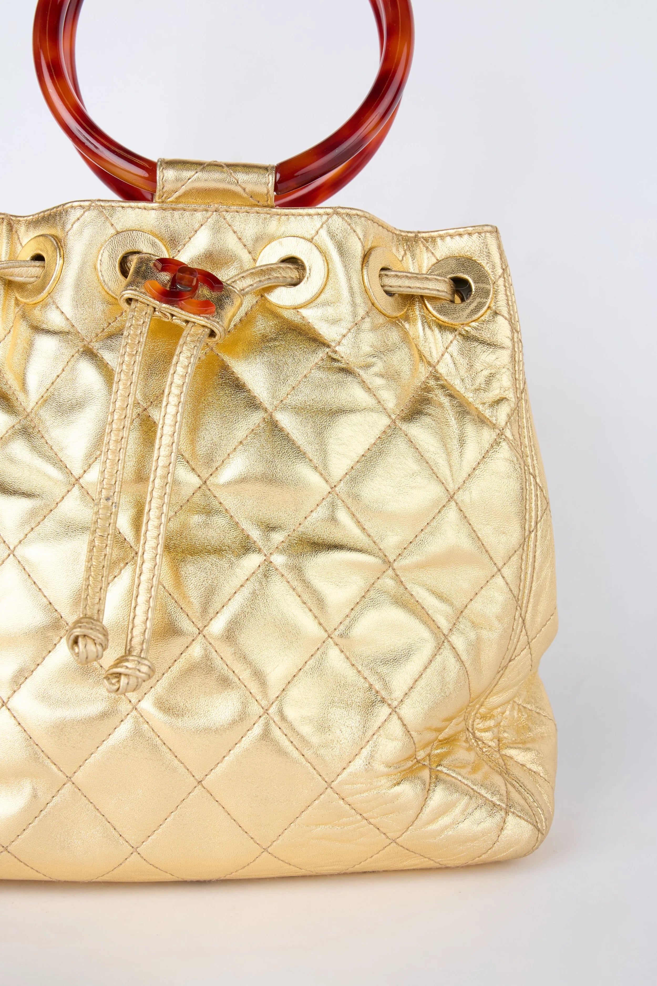 CHANEL CHAMPAGNE GOLD HOBO BUCKET
