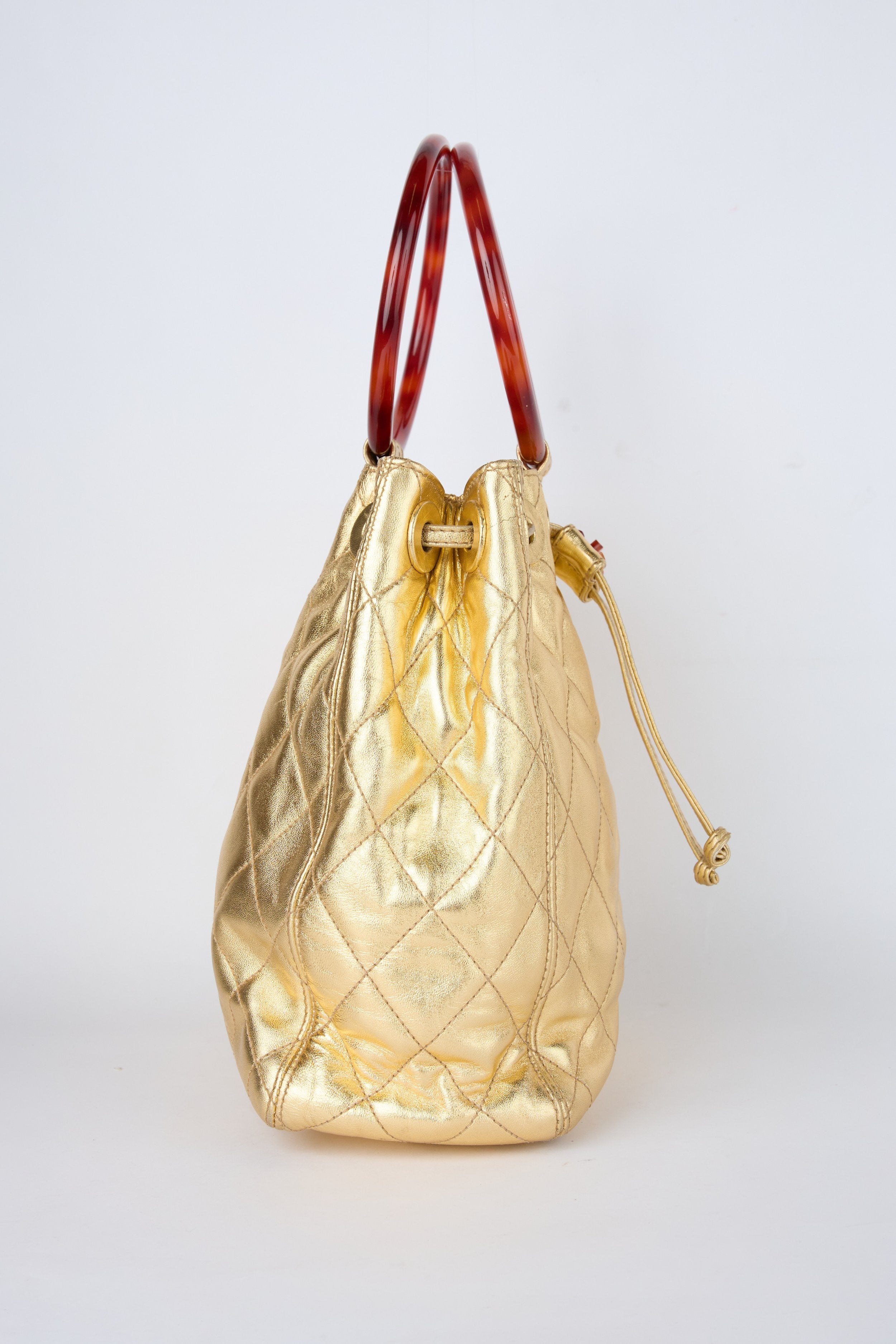 CHANEL CHAMPAGNE GOLD HOBO BUCKET