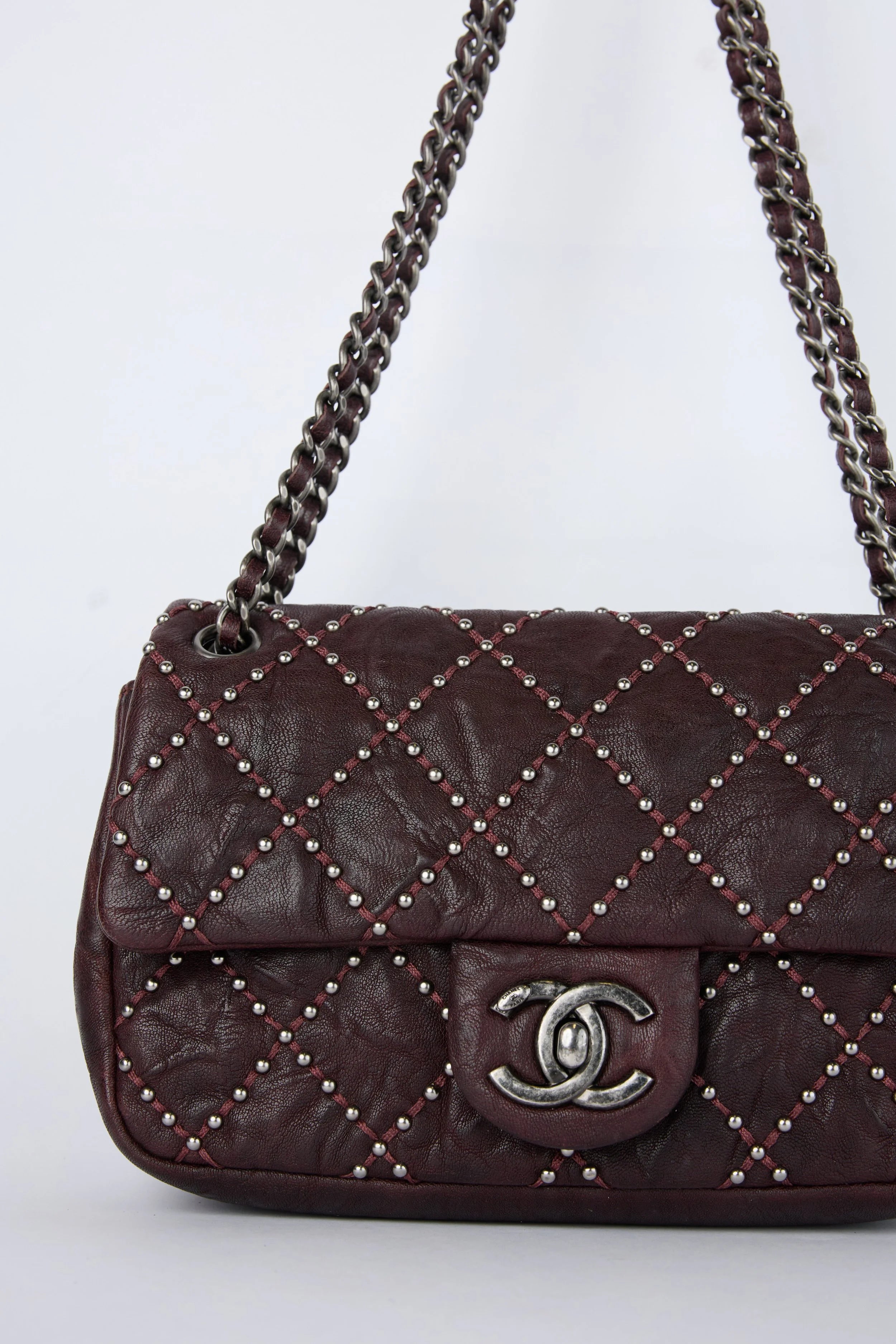 CHANEL BURGUNDY STUDDED FLAP